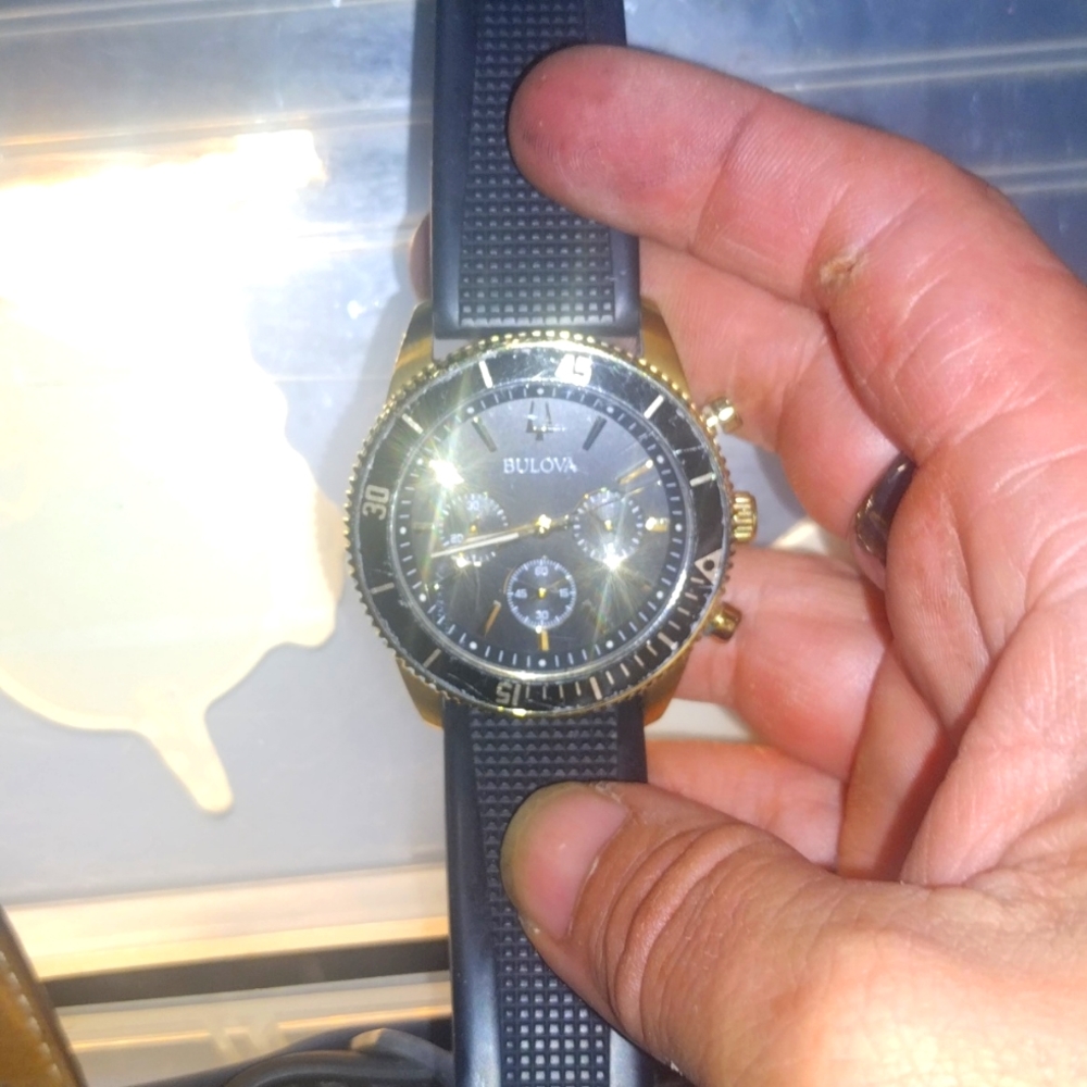 Gold and rubber band Bulova chronograph watch